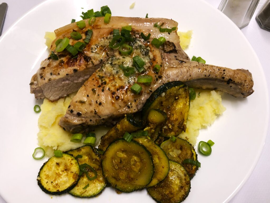 Delicious lamb cutlets with homemade mash potato, fried seasoned zucchini and mash potato at Acacia Motel Chinchilla