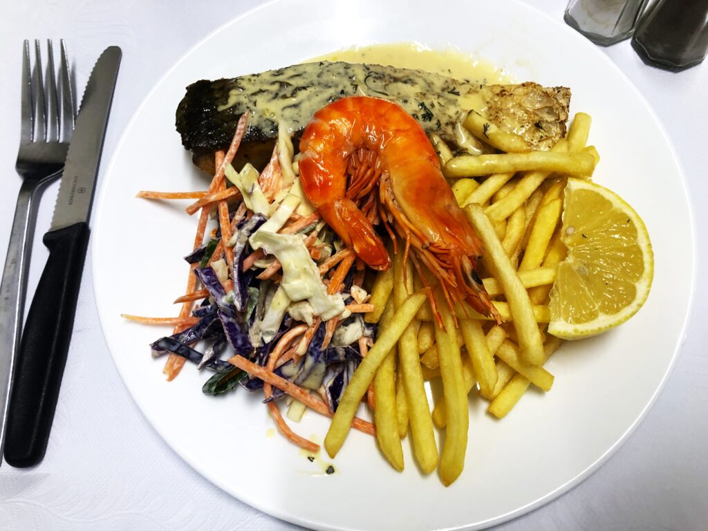Fresh barramundi with homemade slaw, fresh tiger prawn and fries at Acacia motel Chinchilla